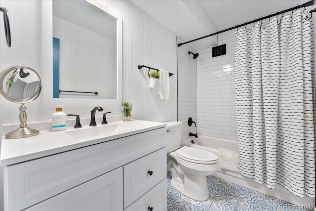 full bathroom with vanity, tile patterned floors, toilet, and shower / bath combo with shower curtain