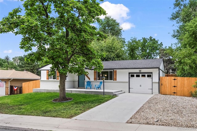 10067 W 68th Pl, Arvada, CO 80004 - ranch-style home featuring an attached garage, driveway, brick siding, and a gate