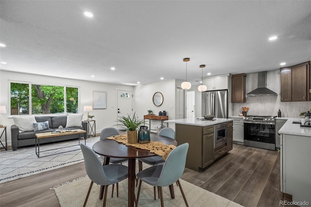 10067 W 68th Pl, Arvada, CO 80004 - dining area featuring dark wood finished floors and recessed lighting