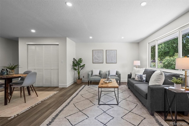 10067 W 68th Pl, Arvada, CO 80004 - living room featuring recessed lighting, wood finished floors, and a textured ceiling