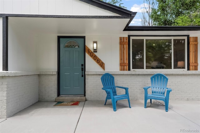 10067 W 68th Pl, Arvada, CO 80004 - doorway to property featuring brick siding