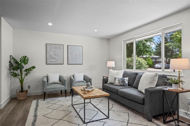 10067 W 68th Pl, Arvada, CO 80004 - living area with light wood-style floors, recessed lighting, and a textured ceiling