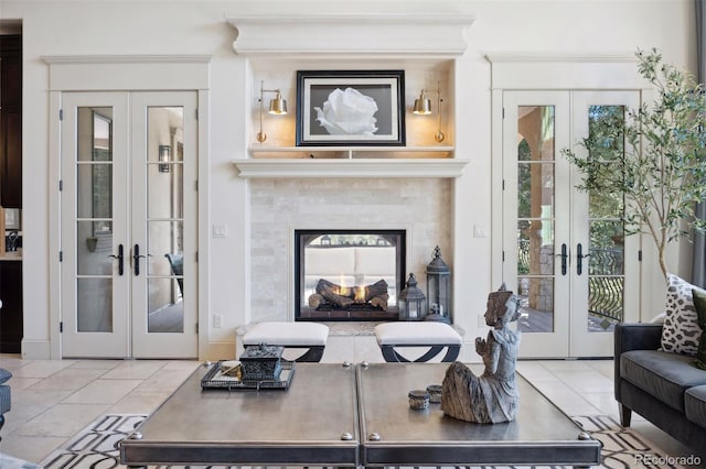 living area with french doors and light tile patterned floors