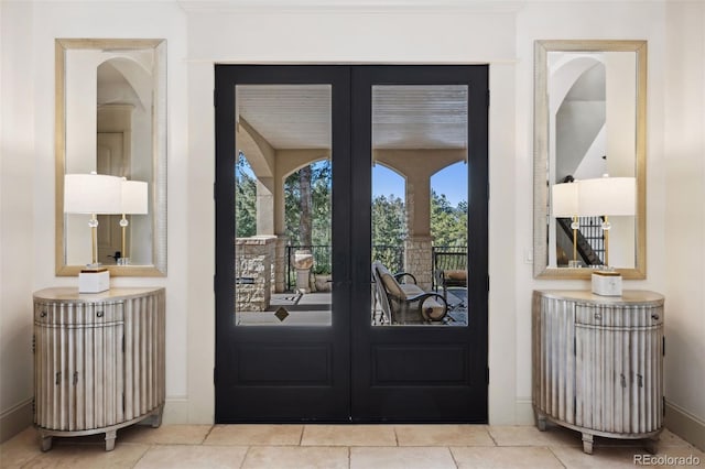 entryway featuring french doors and baseboards