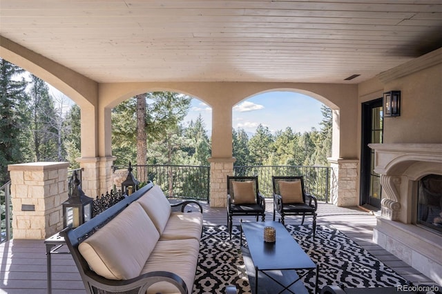 view of patio / terrace featuring an outdoor living space with a fireplace