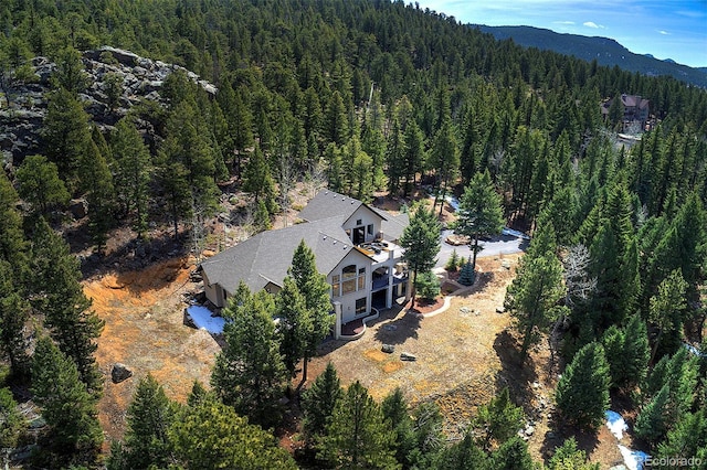 aerial view with a forest view and a mountain view
