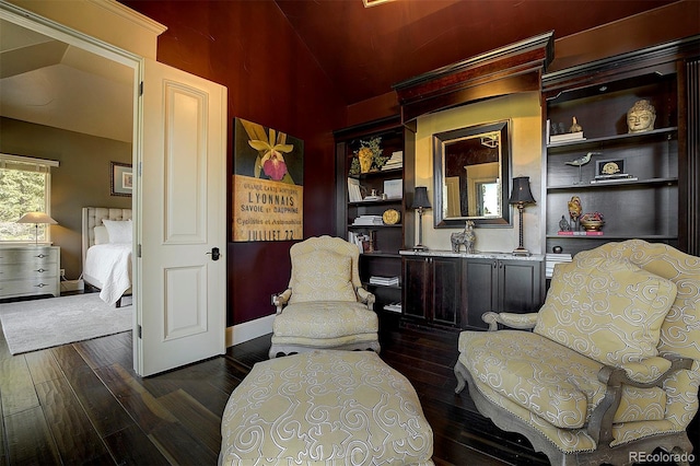 living area with dark wood-style flooring, baseboards, and lofted ceiling