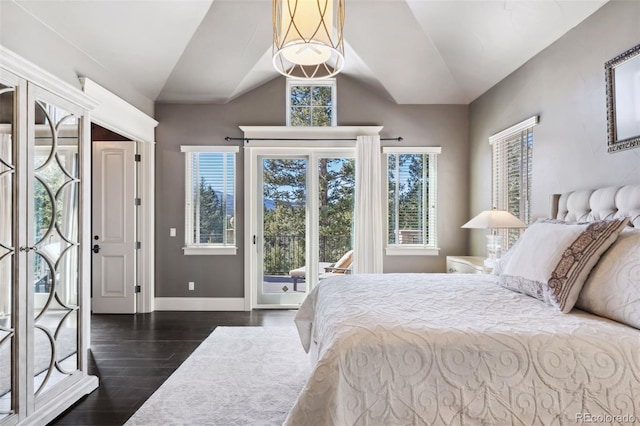 bedroom with baseboards, access to exterior, vaulted ceiling, and wood finished floors