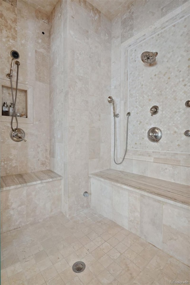 bathroom with a tile shower