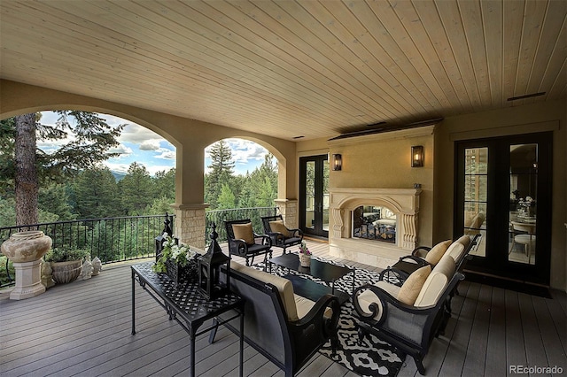 26806 Evergreen Springs Rd, Evergreen, CO 80439 - wooden deck featuring french doors and an outdoor hangout area