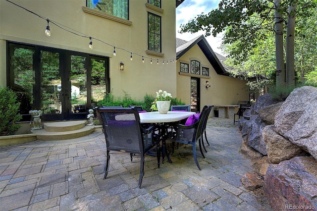 26806 Evergreen Springs Rd, Evergreen, CO 80439 - view of patio / terrace featuring french doors and outdoor dining space
