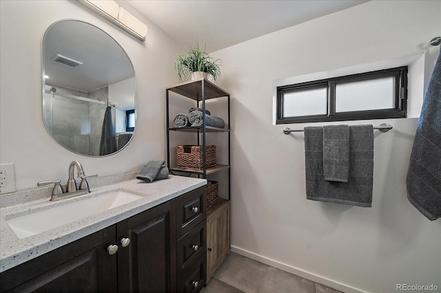 1050 N Corona St Unit 202, Denver, CO 80218 - bathroom featuring vanity, a shower, and baseboards