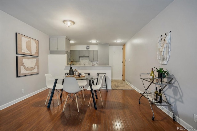 1050 N Corona St Unit 202, Denver, CO 80218 - dining room featuring baseboards and dark wood-style floors