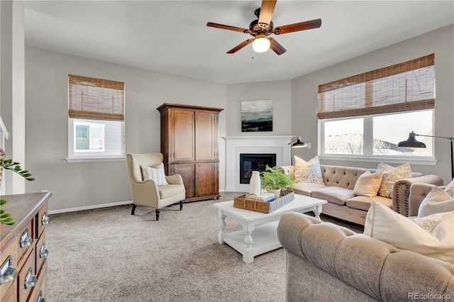 living room featuring light carpet, a wealth of natural light, and ceiling fan