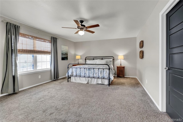 bedroom featuring ceiling fan and carpet