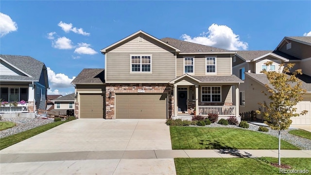 craftsman-style house featuring a garage, a front yard, and covered porch