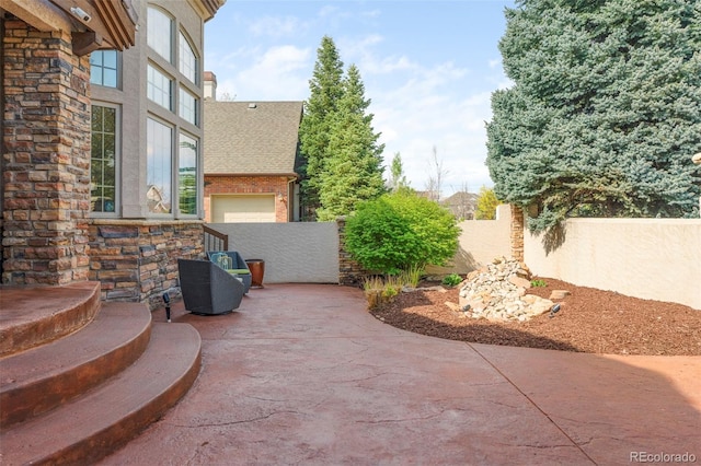 155 S Poplar St, Denver, CO 80230 - view of patio with fence and a garage