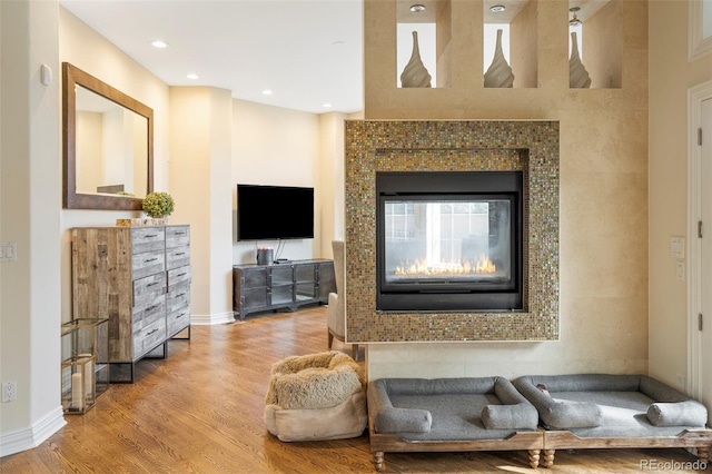 155 S Poplar St, Denver, CO 80230 - living room featuring wood finished floors, a fireplace, baseboards, and recessed lighting
