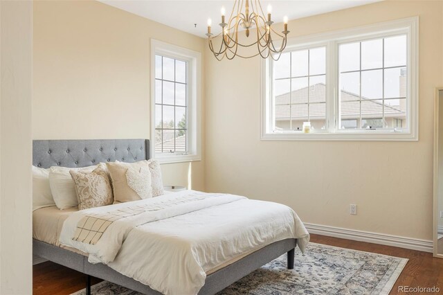 155 S Poplar St, Denver, CO 80230 - bedroom featuring a chandelier, baseboards, and dark wood finished floors