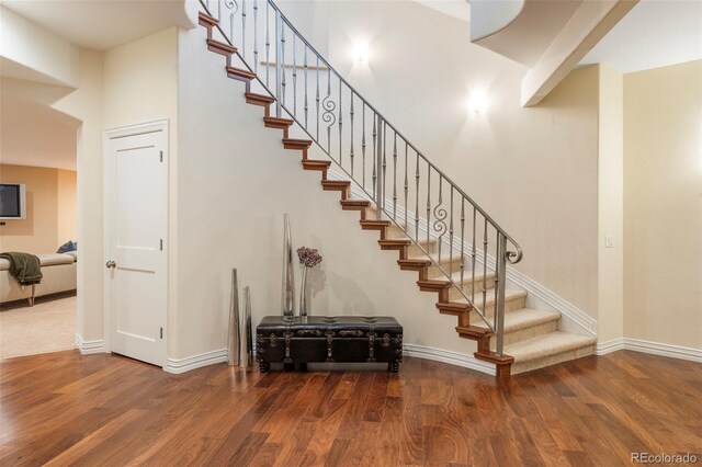 155 S Poplar St, Denver, CO 80230 - stairs with wood finished floors, baseboards, and a high ceiling