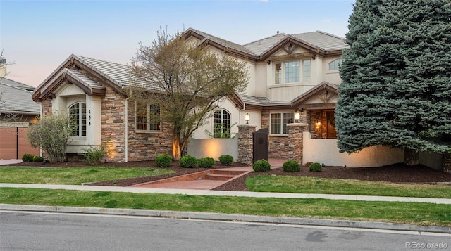 155 S Poplar St, Denver, CO 80230 - craftsman house featuring stone siding, stucco siding, and a tiled roof