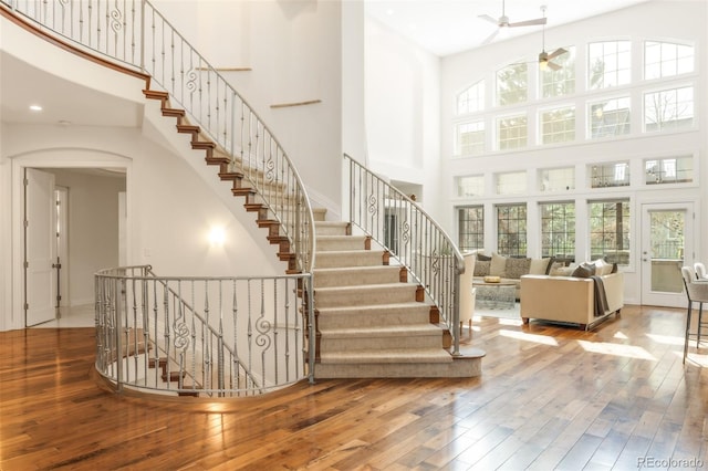 155 S Poplar St, Denver, CO 80230 - stairway featuring a towering ceiling, ceiling fan, wood-type flooring, arched walkways, and recessed lighting