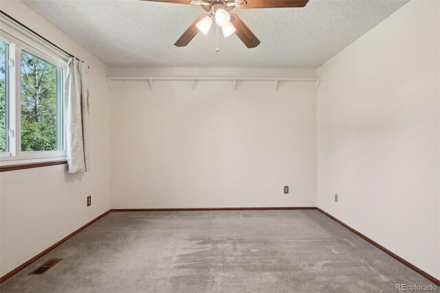 5612 S Jebel Way, Centennial, CO 80015 - spare room featuring light carpet, ceiling fan, a textured ceiling, and baseboards