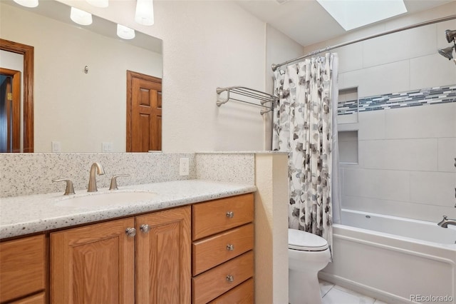 5612 S Jebel Way, Centennial, CO 80015 - full bath featuring toilet, vanity, shower / tub combo with curtain, a skylight, and tile patterned flooring
