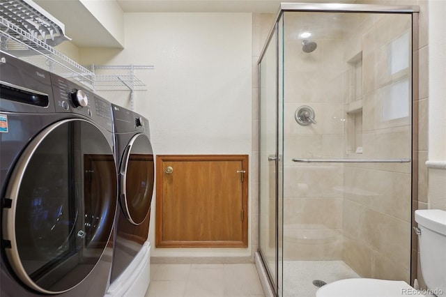 5612 S Jebel Way, Centennial, CO 80015 - washroom with washer and clothes dryer and light tile patterned floors