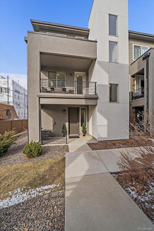 view of front of property with a balcony