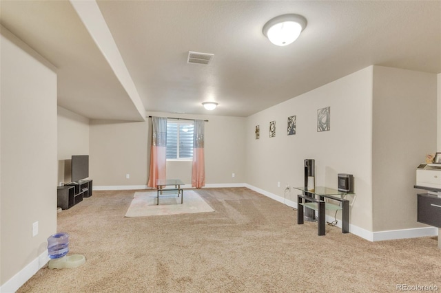 unfurnished living room featuring carpet floors, baseboards, and visible vents