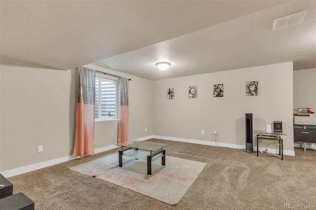 unfurnished living room featuring baseboards, carpet flooring, and visible vents