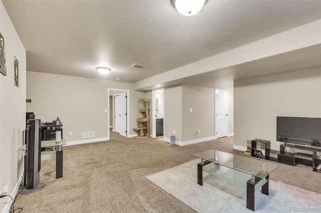 carpeted living room featuring visible vents, baseboards, and stairway