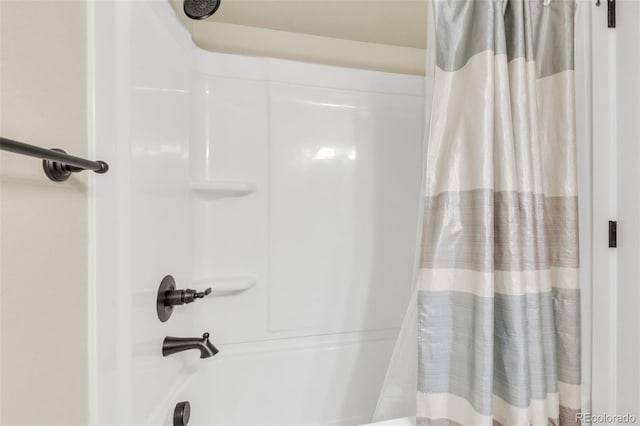 full bathroom featuring shower / bath combo with shower curtain