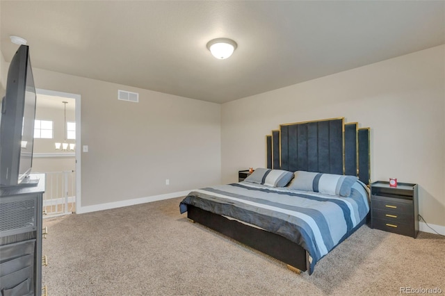 bedroom with visible vents, carpet flooring, and baseboards