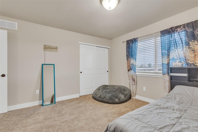 bedroom featuring baseboards, carpet flooring, and visible vents