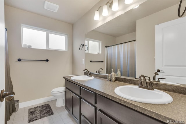 full bathroom featuring a sink, baseboards, toilet, and visible vents