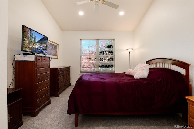 bedroom featuring ceiling fan, vaulted ceiling, and light carpet