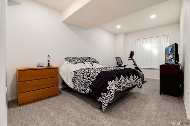 bedroom featuring light colored carpet