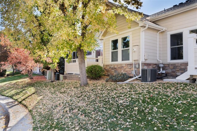 view of home's exterior with central AC