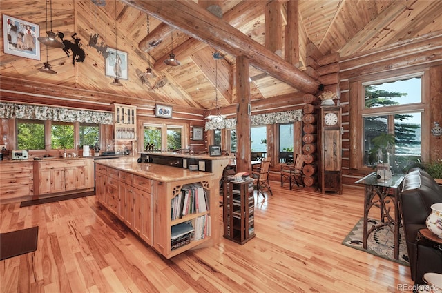 kitchen with wood ceiling, high vaulted ceiling, pendant lighting, and light hardwood / wood-style floors