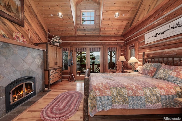 bedroom with wood-type flooring, vaulted ceiling, multiple windows, and wood ceiling