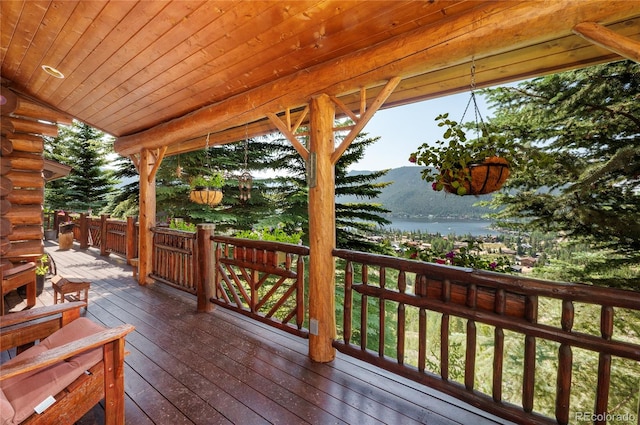 wooden deck featuring a water view