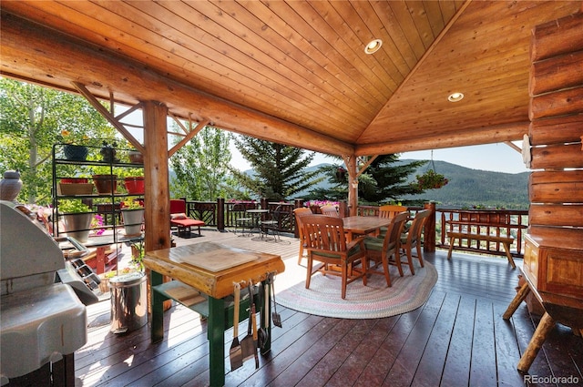 wooden terrace featuring a mountain view and a gazebo