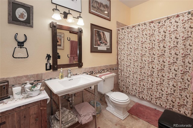 bathroom with tile patterned flooring and toilet