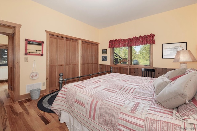 bedroom with hardwood / wood-style floors