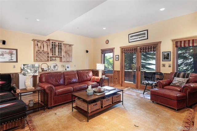 living room with light hardwood / wood-style flooring and french doors