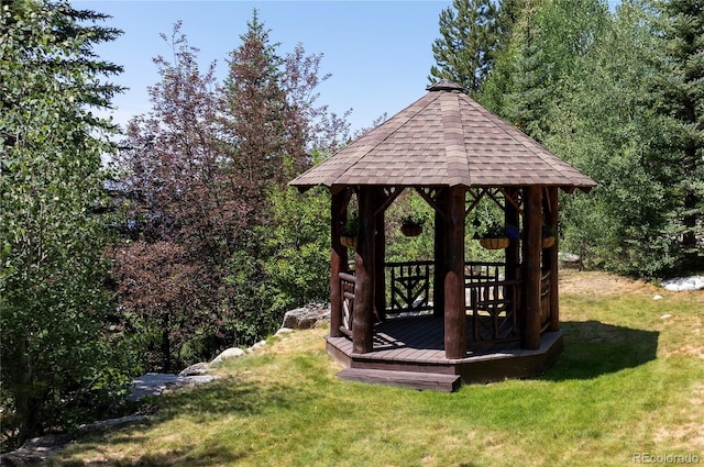 view of outdoor structure with a gazebo and a lawn