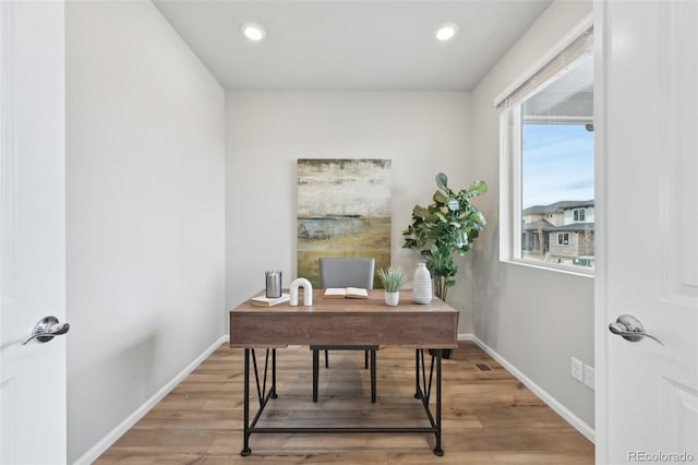 office area featuring light wood-style flooring, baseboards, and recessed lighting