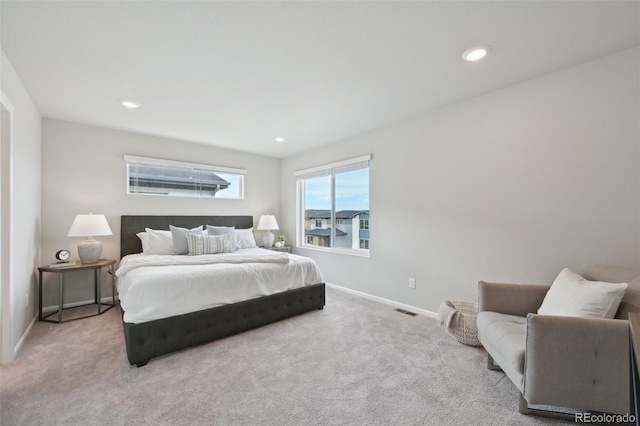 carpeted bedroom with baseboards, visible vents, and recessed lighting